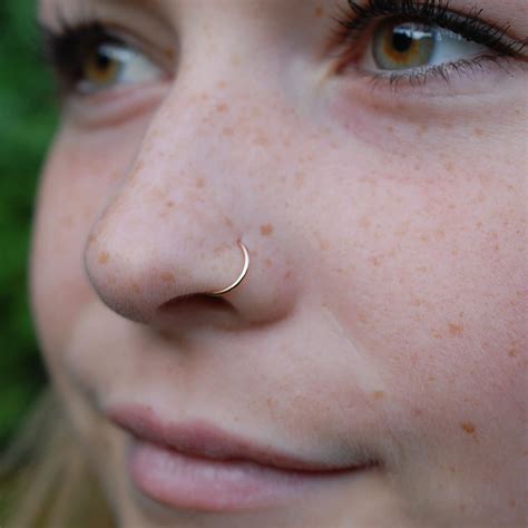 14 karat gold nose ring.